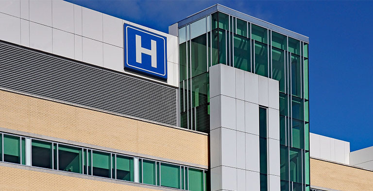 Building with large H sign for hospital