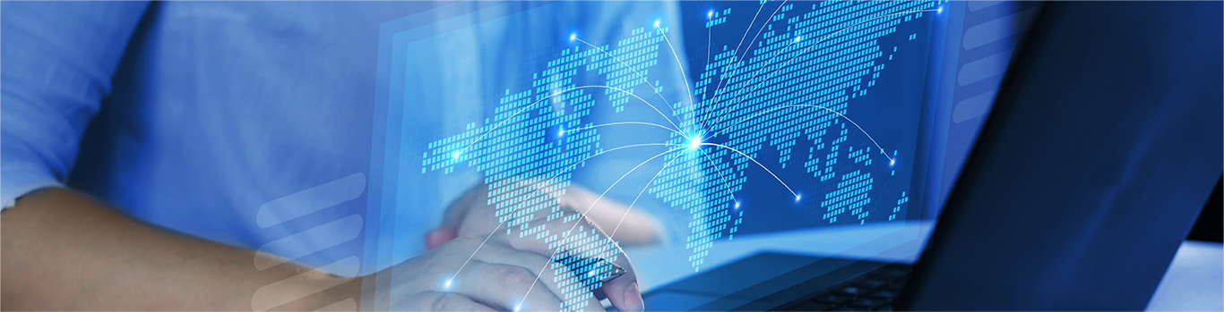 Man typing on a laptop with a holographic map being projected from the laptop screen