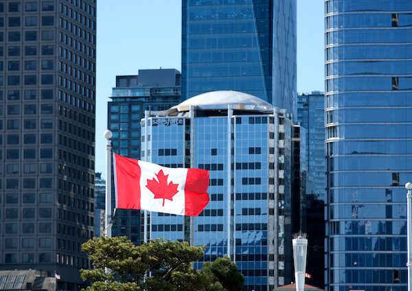 National Canadian Flag Overlay. Canada Place and commercial buildings in Downtown Vancouver Viewed from water during sunny summer day. British Columbia, Canada. High quality photo